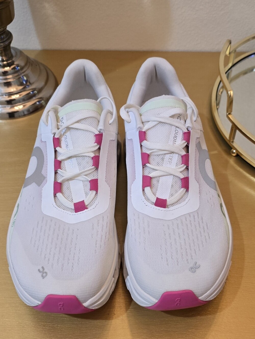 On Running White Athletic Shoes with Pink Accents